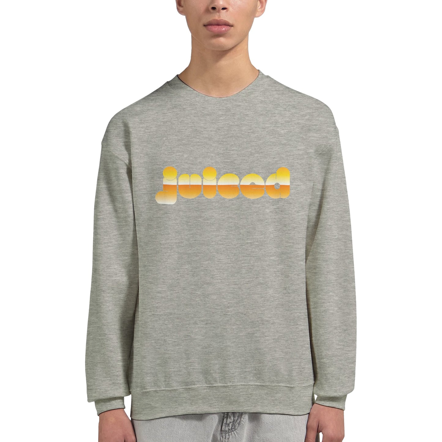 Model wearing Juiced sweatshirt by Taste Union — unisex grey crewneck with yellow text design inspired by natural wine and slow living, photographed on white background.