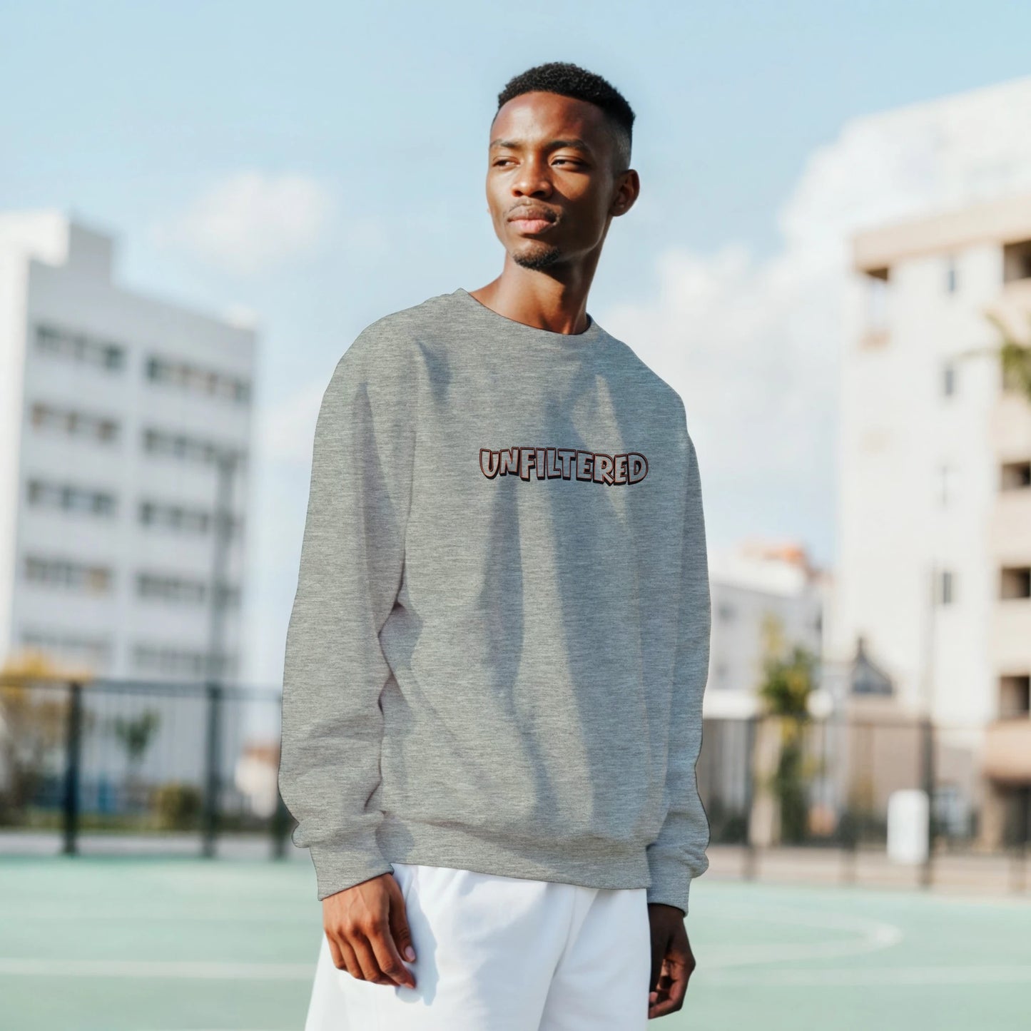 Model wearing Unfiltered sweatshirt by Taste Union — unisex grey crewneck with brown text inspired by natural wine and authenticity, photographed outdoors in natural light.