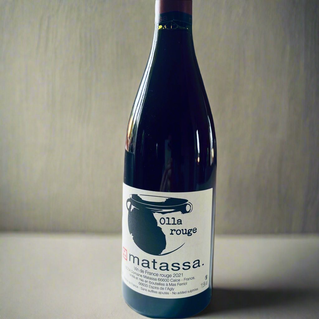 Bottle of Matassa Olla Rouge 2021, a biodynamic natural red wine from Roussillon, France, featuring a blend of Grenache Noir, Grenache Blanc, Grenache Gris, and Macabeu with a light, earthy and fresh character.