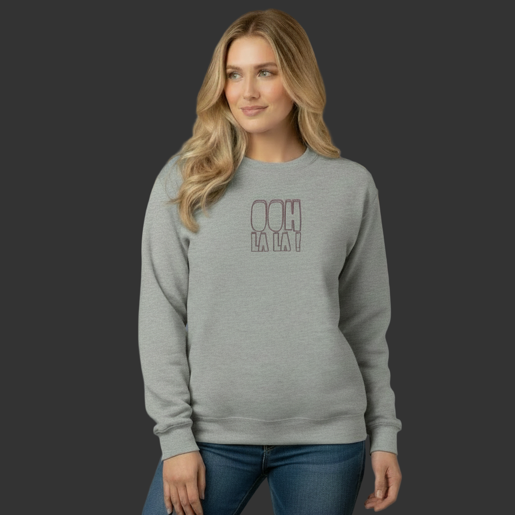 Woman wearing a gray sweatshirt with red text on a beige background