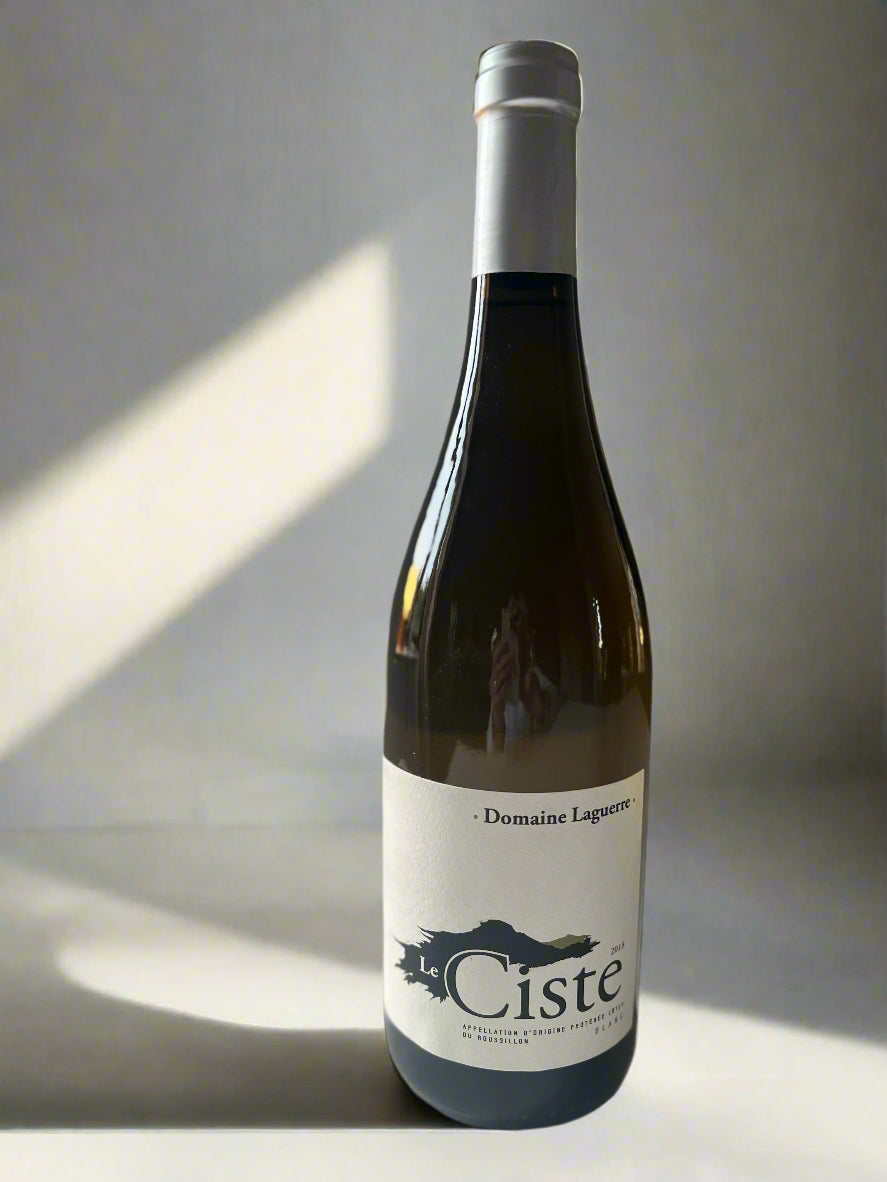 Bottle of Domaine Laguerre Le Ciste 2018 white wine, showcasing elegant labelling and reflecting its biodynamic origins from Côtes de Roussillon.