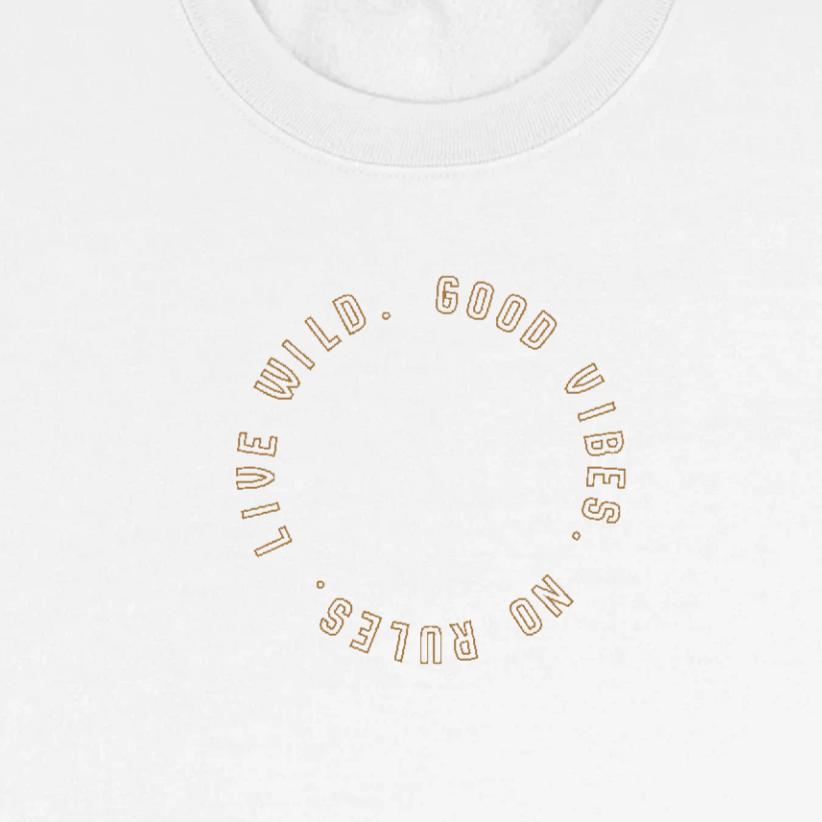Circular logo design with text "WILD GOOD VIBES NO RULES" arranged in a curved arc on cream background with gold outlined lettering