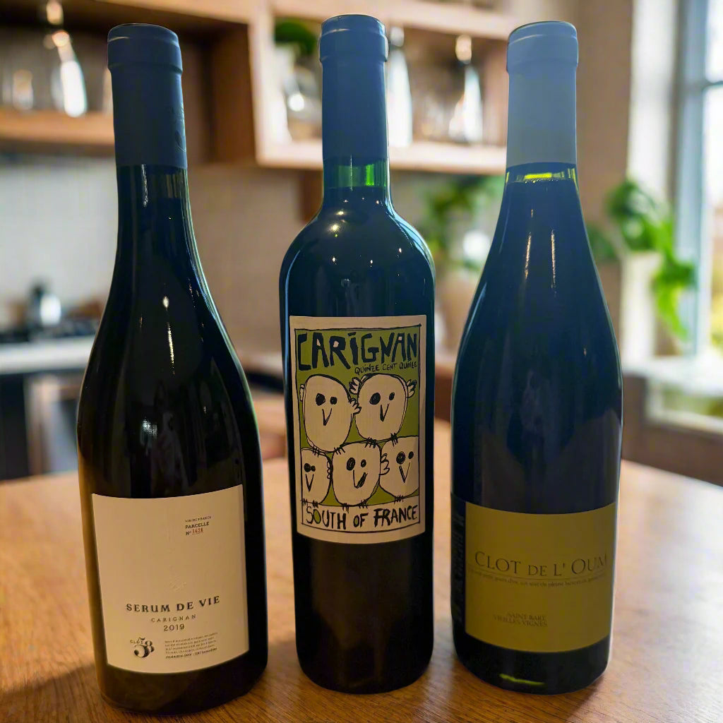 Three bottles of natural red wine from Languedoc-Roussillon, including Clos 58 Serum de Vie, Colline de l’Hirondelle Carignan, and Clot de l’Oum Saint Barts. A gift-ready organic wine trio perfect for birthdays, fathers day, Christmas, dinner parties, or just because.