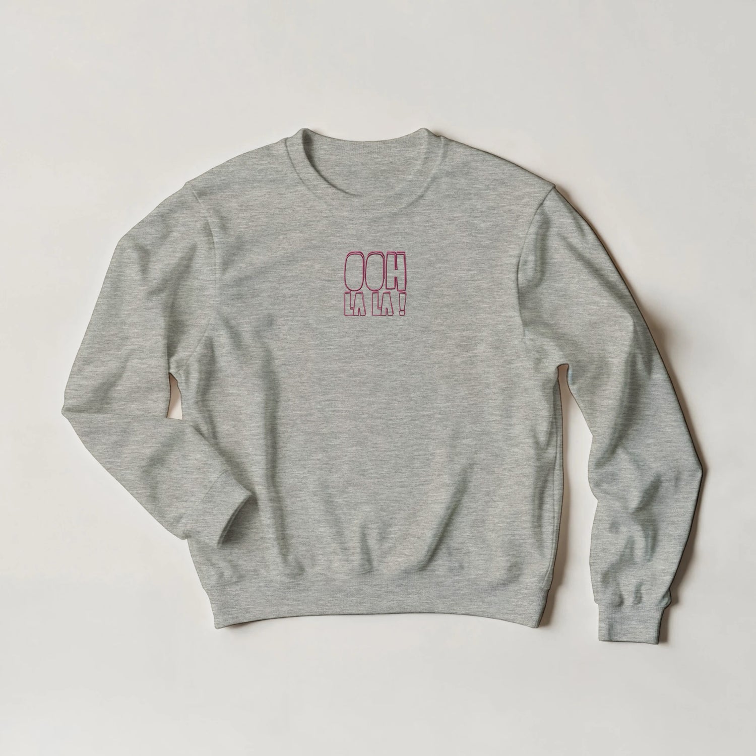 Grey marl sweatshirt with pink embroidered text ‘Ooh La La!’. Sustainable unisex sweatshirt by Taste Union.