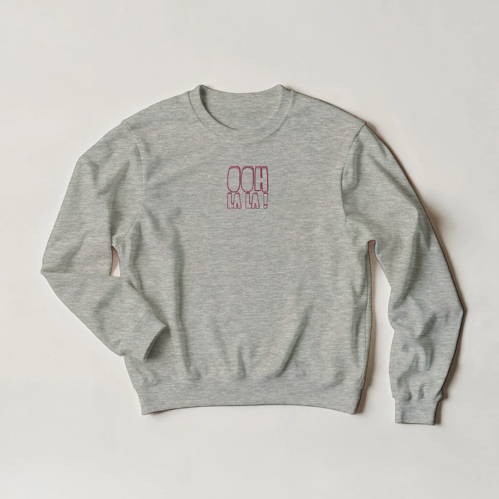 Grey marl sweatshirt with pink embroidered text ‘Ooh La La!’. Sustainable unisex sweatshirt by Taste Union.