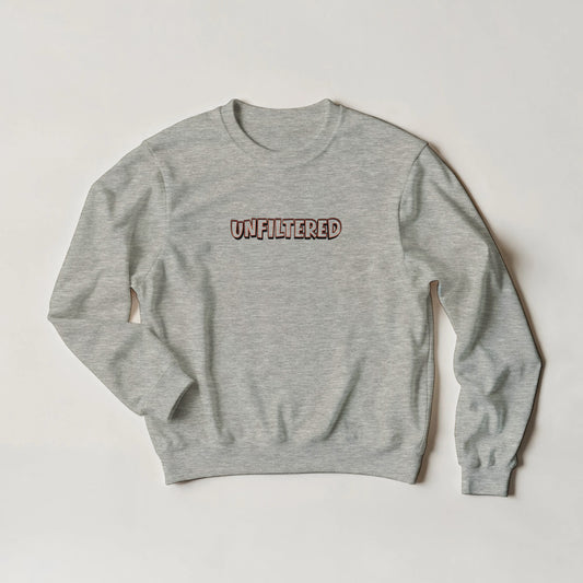 Unfiltered sweatshirt by Taste Union — unisex grey crewneck featuring bold brown text inspired by natural wine culture and slow living, photographed on a neutral background.