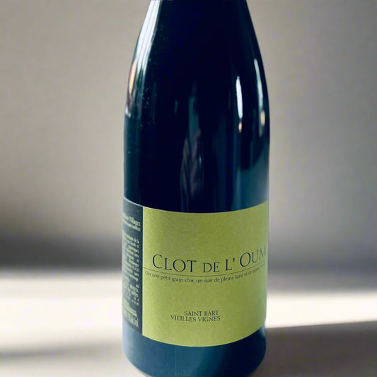 Bottle of Clot de L'Oum St Barts 2014 red wine with a green label featuring "Saint Bart Vieilles Vignes." Photographed on a light surface with natural lighting.