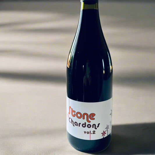 Bottle of Domaine Pion Stone & Chardons 2021 red wine on a light background, showcasing its elegant label design.